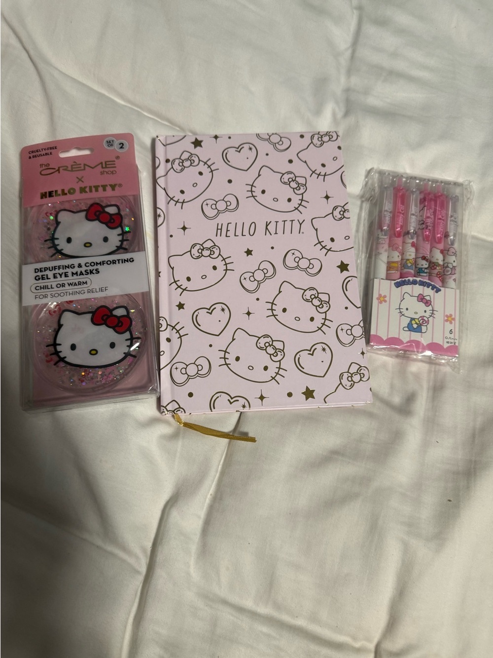 Hello Kitty Pink Journal, featuring a pack of six pens and an eye mask gift set!